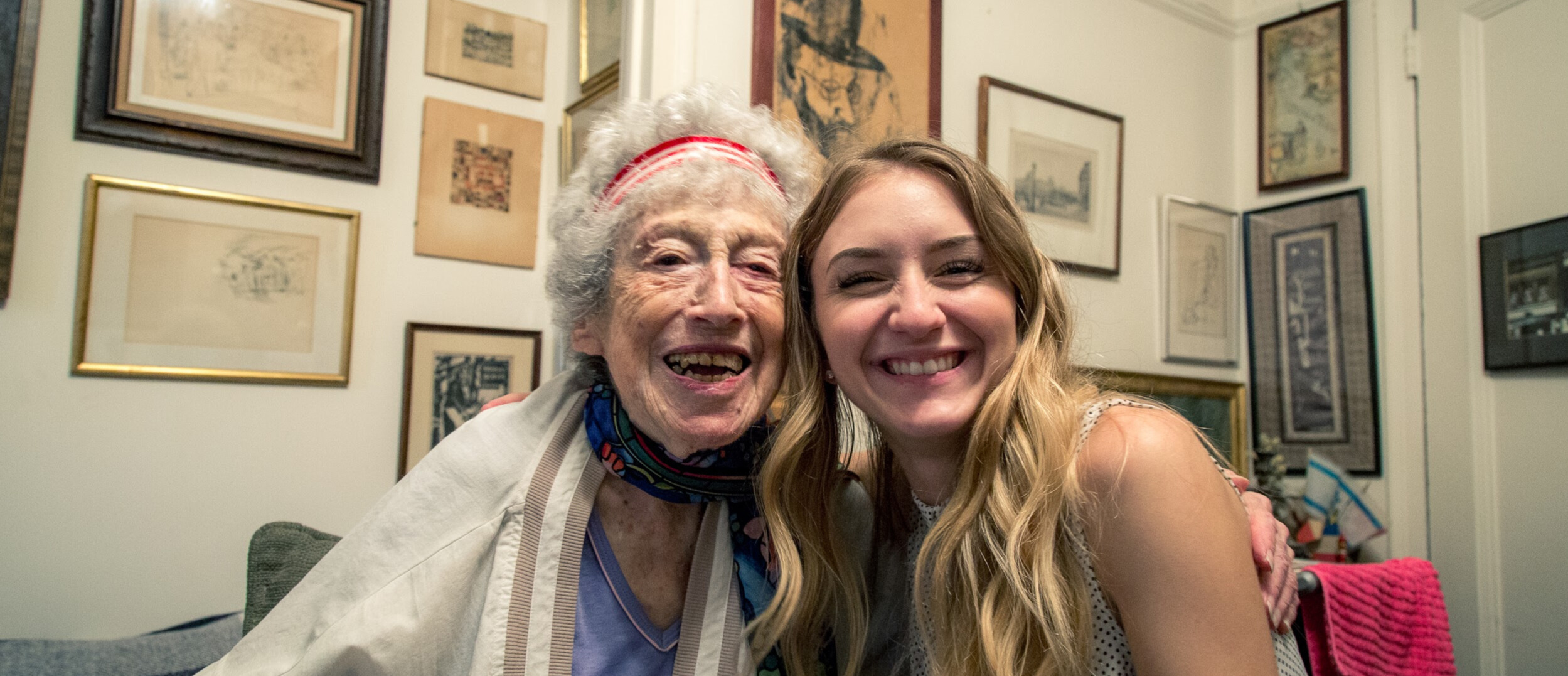 older woman and younger woman smiling